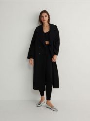 Legginsy z metalicznym efektem - czarny. Czarne legginsy Reserved, l, bez wzorów, z dzianiny. W wyprzedaży za 39.99 zł.