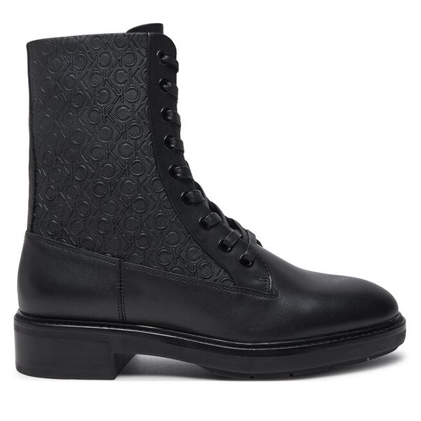 Trzewiki Calvin Klein. Czarne botki Calvin Klein, bez wzorów, bez obcasa, na płaskiej podeszwie, bez zapięcia. Za 549.99 zł.