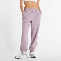 Spodnie damskie New Balance WP41500ICW – różowe. Czerwone spodnie dresowe New Balance, xl, bez wzorów, z bawełny. Za 129.99 zł.