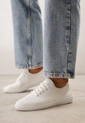 Białe Minimalistyczne Tenisówki z Imitacji Skóry z Drobną Perforacją Lalosa. Białe trampki Born2be, bez wzorów, z dzianiny, bez zapięcia. Za 59.99 zł.