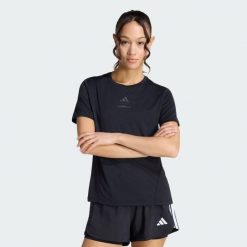 Koszulka Les Mills Graphic. Czarne bluzki Adidas, bez wzorów, sportowe, bez kołnierzyka, bez ramiączek. Za 199.00 zł.