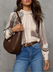 Milan Kiss Bluzka w kolorze kremowo-brązowym rozmiar: L. Brązowe bluzki Milan Kiss, l, bez wzorów, bez kołnierzyka, bez ramiączek. Za 152.99 zł.