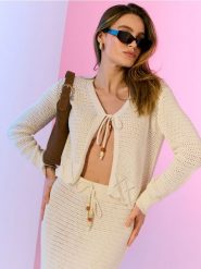 Ażurowy kardigan z wiązaniem - kremowy. Białe kardigany Sinsay, l, w ażurowe wzory. Za 49.99 zł.