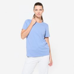 Koszulka damska Domyos Gym & Pilates. Niebieskie bluzki DOMYOS, xl, bez wzorów, z bawełny, sportowe, bez kołnierzyka, bez ramiączek. Za 39.99 zł.