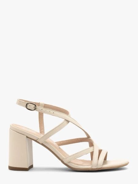 Kremowe sandały damskie na stabilnym obcasie. Brązowe sandały Ryłko, bez wzorów, ze skóry, bez obcasa, na obcasie, bez zapięcia. W wyprzedaży za 279.99 zł.