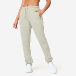Spodnie dresowe damskie Domyos Gym & Pilates slim. Zielone spodnie dresowe DOMYOS, xl, bez wzorów, z dresówki, na fitness i siłownię. Za 89.99 zł.