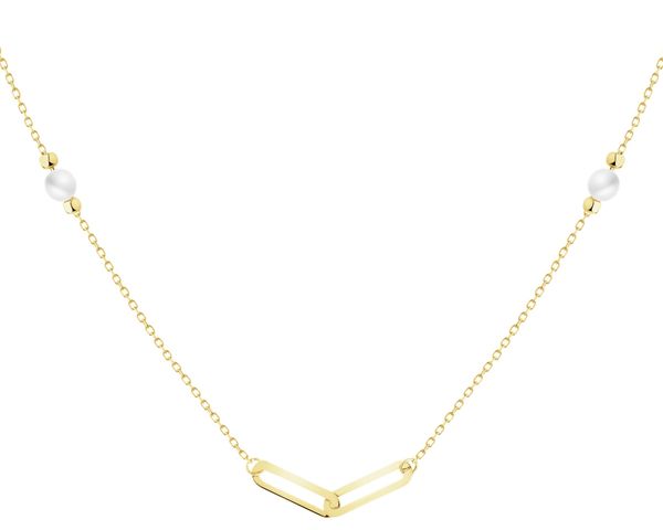 Złoty naszyjnik z perłami i cyrkonią - paper clip. Żółte naszyjniki Apart, z cyrkonią, złote. Za 1,599.00 zł.