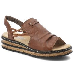 Sandały damskie Rieker, cholewka ze skóry ekologicznej elastyczne paski z tyłu na płaskiej podeszwie, brązowe, 62962-22. Brązowe sandały Rieker, bez wzorów, ze skóry ekologicznej, bez obcasa, na koturnie, bez zapięcia. Za 299.00 zł.