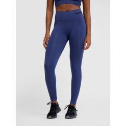 Damskie legginsy bezszwowe z wysoką talią Hummel TIF. Niebieskie legginsy Hummel, bez wzorów, na fitness i siłownię. Za 143.00 zł.