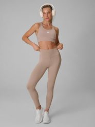 4F Legginsy treningowe szybkoschnące damskie - beżowe S. Brązowe legginsy sportowe 4f, s, bez wzorów, z podwyższonym stanem, na fitness i siłownię. Za 119.99 zł.