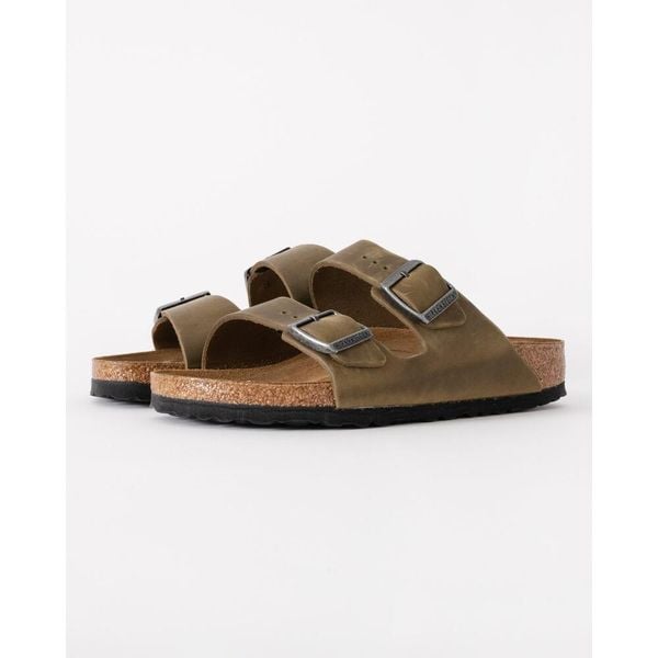 Klapki damskie Birkenstock 1027039. Zielone klapki Birkenstock, bez wzorów, z materiału, bez obcasa. Za 569.45 zł.