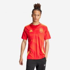 Koszulka piłkarska drużyny Hiszpanii ADIDAS domowa. Czerwone bluzki Adidas, l, bez wzorów, sportowe, bez kołnierzyka, bez ramiączek. Za 449.99 zł.