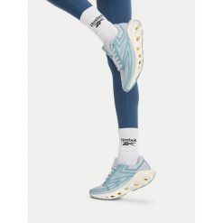 Buty do biegania Reebok. Niebieskie obuwie sportowe Reebok, bez zapięcia, do biegania. Za 349.99 zł.