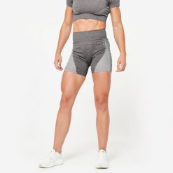 Spodenki fitness cardio damskie Domyos seamless. Czarne obuwie sportowe DOMYOS, z materiału, bez zapięcia, na fitness i siłownię. W wyprzedaży za 59.99 zł.