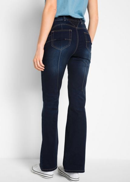 Modelujące dżinsy o kroju bootcut, mid waist. Niebieskie jeansy bonprix, bez wzorów. Za 144.99 zł.