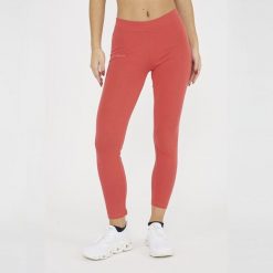 Legginsy do jogi damskie z elastycznej bawełny koralowe. Pomarańczowe legginsy LEGEA, s, bez wzorów, z bawełny, z podwyższonym stanem. Za 60.00 zł.