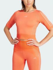 Adidas Koszulka sportowa w kolorze pomarańczowym rozmiar: M. Pomarańczowe koszulki sportowe Adidas, bez wzorów, bez ramiączek, outdoorowe. Za 73.95 zł.