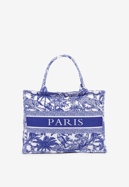 Niebieska Torebka Typu Shopper Ozdobiona Napisem i Tropikalnym Wzorem Alinarema. Niebieskie shopper Born2be, bez wzorów, z jeansu, eleganckie, bez dodatków. Za 49.99 zł.