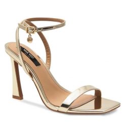 Sandały Nine West. Żółte sandały Nine West, bez wzorów, bez obcasa, na słupku, bez zapięcia. Za 229.99 zł.