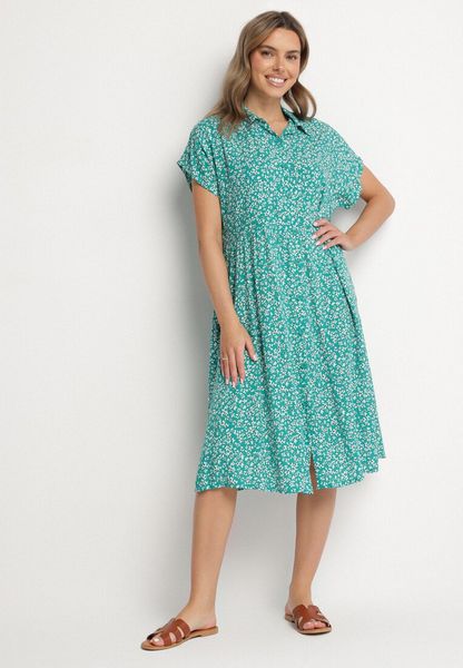 Ciemnozielona Bawełniana Sukienka Koszulowa w Kwiaty z Rozkloszowanym Dołem Jerilsa. Zielone sukienki Born2be, na co dzień, l, bez wzorów, z bawełny, eleganckie, bez kołnierzyka, bez ramiączek, mini, koszulowe. Za 59.99 zł.