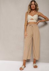 Beżowe Spodnie High Waist z Szerokimi Nogawkami z Wiskozą Wykończone Gumką w Talii Crisantas. Brązowe spodnie sportowe Renee, l, bez wzorów, z jeansu, z podwyższonym stanem. Za 29.99 zł.