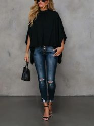 Milan Kiss Bluzka w kolorze czarnym rozmiar: S. Czarne bluzki Milan Kiss, s, bez wzorów, bez kołnierzyka, bez ramiączek. Za 130.99 zł.