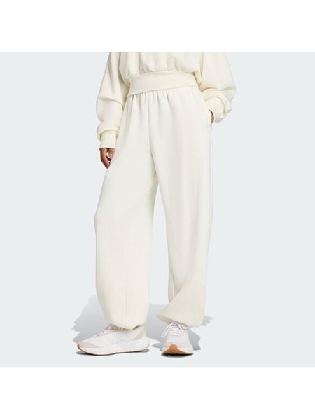 Adidas Spodnie dresowe Soft Lux JV9896 Kremowy Regular Fit. Białe spodnie dresowe Adidas, xs, bez wzorów, z dresówki. Za 233.99 zł.