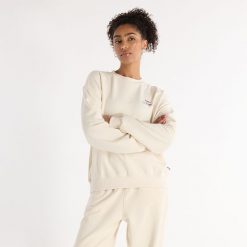 Bluza damska New Balance WT43559LIN – beżowa. Brązowe bluzy New Balance, l, bez wzorów, z bawełny, bez kaptura. Za 129.99 zł.