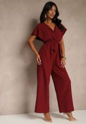 Bordowy Elegancki Kombinezon z Szerokimi Nogawkami i Kopertowym Dekoltem Melovina. Czerwone sukienki Renee, na co dzień, na jesień, l, bez wzorów, eleganckie, bez kołnierzyka, bez ramiączek, kopertowe. Za 149.99 zł.