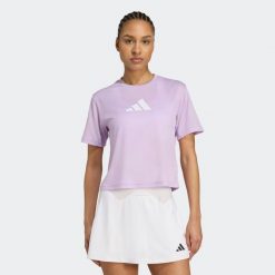 Koszulka fitness damska ADIDAS. Fioletowe bluzki Adidas, l, bez wzorów, z materiału, sportowe, bez kołnierzyka, bez ramiączek. W wyprzedaży za 69.99 zł.
