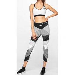 Legginsy do biegania damskie SPDF102 - multikolor 1 allover. Legginsy 4f, bez wzorów, z dzianiny. W wyprzedaży za 99.99 zł.