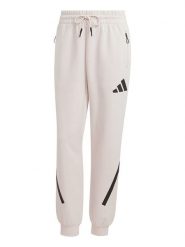 Adidas Spodnie dresowe "Z.N.E." w kolorze kremowym rozmiar: M. Brązowe spodnie dresowe Adidas, m, bez wzorów, z dresówki. Za 187.07 zł.