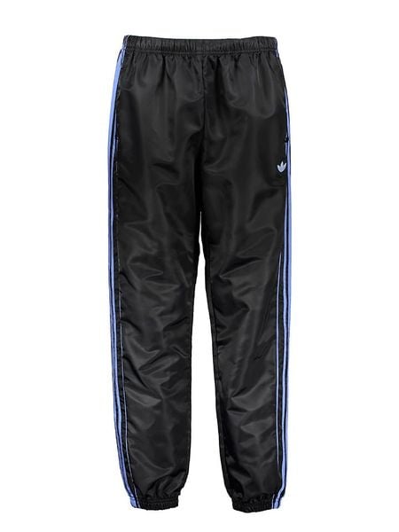 Adidas Spodnie dresowe w kolorze czarno-niebieskim rozmiar: L. Czarne spodnie dresowe Adidas, l, bez wzorów, z dresówki. Za 135.49 zł.