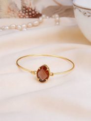 Pierres de Jade Pozłacana bransoletka z cyrkonią rozmiar: onesize. Brązowe bransoletki Pierres de Jade, z cyrkonią, pozłacane. Za 38.17 zł.