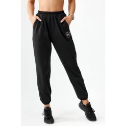 Spodnie dresowe sportowe dla kobiet Rough Radical Pery. Czarne obuwie sportowe ROUGH RADICAL, m, bez wzorów, z dresówki, na fitness i siłownię. W wyprzedaży za 135.92 zł.