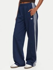Adidas Spodnie dresowe Firebird KV5403 Niebieski Loose Fit. Niebieskie spodnie dresowe Adidas, s, bez wzorów, z dresówki. Za 299.99 zł.