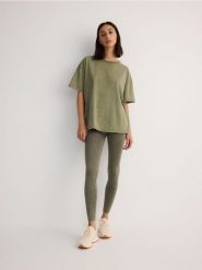 Bezszwowe legginsy - oliwkowy. Zielone legginsy Reserved, l, bez wzorów, z dzianiny. W wyprzedaży za 39.99 zł.