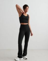 Damskie legginsy rozszerzane z wysokim stanem dla wysokich czarne. Czarne legginsy AIM'N, l, bez wzorów, z elastanu, z podwyższonym stanem, na fitness i siłownię. Za 344.00 zł.