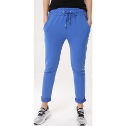 Niebieskie Spodnie Dresowe Tempted. Spodnie dresowe marki Born2be. Za 59.99 zł.