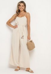 Jasnobeżowy Kombinezon na Cienkich Regulowanych Ramiączkach ze Ściągaczem w Talii Huetta. Brązowe sukienki Born2be, na spotkanie biznesowe, na lato, l, bez wzorów, z jeansu, eleganckie, bez kołnierzyka, bez ramiączek. Za 89.99 zł.