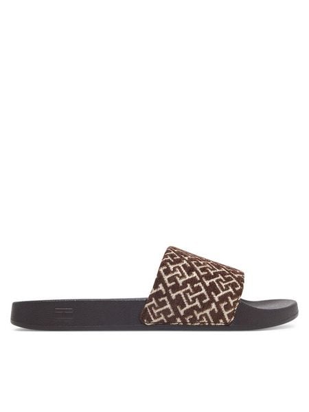 Tommy Hilfiger Klapki Th Monogram Pool Slide FW0FW09611 Brązowy. Brązowe klapki TOMMY HILFIGER, bez wzorów, z materiału, bez obcasa. Za 169.99 zł.