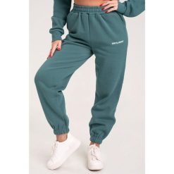 Spodnie fitness damskie Gym Glamour dresowe. Niebieskie spodnie dresowe GYM GLAMOUR, xs, bez wzorów, z dresówki, na fitness i siłownię. Za 189.99 zł.