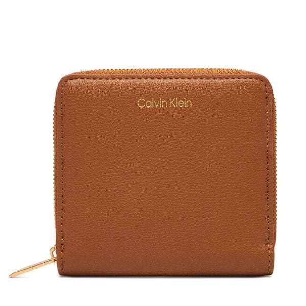 Portfel Calvin Klein. Brązowe portfele Calvin Klein, bez wzorów. Za 249.99 zł.