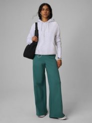 4F Spodnie dresowe z szerokimi nogawkami damskie - turkusowe XS. Niebieskie spodnie dresowe 4f, s, bez wzorów, z bawełny. Za 149.99 zł.