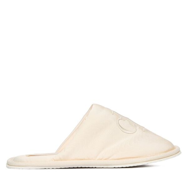 Kapcie Calvin Klein Jeans. Obuwie domowe Calvin Klein Jeans, bez wzorów, z jeansu, bez zapięcia. Za 209.99 zł.