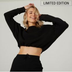 Bluza damska Domyos Gym & Pilates crop. Czarne bluzy DOMYOS, s, bez wzorów, z bawełny, bez kaptura. W wyprzedaży za 59.99 zł.