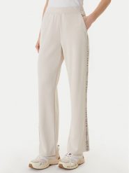 Guess Spodnie dresowe W6GB29 K3282 Beżowy Regular Fit. Brązowe spodnie dresowe Guess, s, z aplikacjami, z dresówki. Za 469.99 zł.