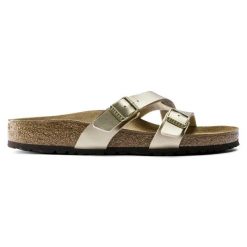 Klapki damskie BIRKENSTOCK Yao Balance BF Gold. Żółte klapki Birkenstock, bez wzorów, ze skóry, bez obcasa. Za 359.99 zł.