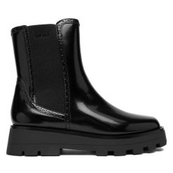 Sztyblety DKNY. Czarne botki DKNY, bez wzorów, bez obcasa, na płaskiej podeszwie, bez zapięcia. Za 789.99 zł.