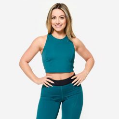 Koszulka fitness damska Domyos crop top bez rękawów. Niebieskie koszulki sportowe DOMYOS, bez wzorów, z elastanu, bez ramiączek, na fitness i siłownię. Za 69.99 zł.